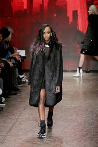Angel Haze walks the runway at the DKNY Women's fashion show during Mercedes-Benz Fashion Week Fall 2014 on February 9, 2014 in New York City.