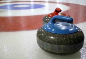 Curling_stones_on_rink_with_visible_pebble(1)