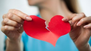 woman-ripping-paper-heart-breakup
