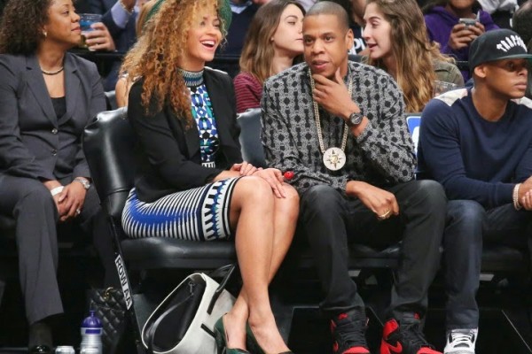 Jay-Z with wife Beyonce Knowles, sporting a Five Percenter medallion rockets_nets_basketball