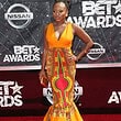 The power woman in Power Naturi Naughton fabulously glowing wearing a dress to channel her natural roots. I say save it for another time, the queen in you deserves summer glam!
