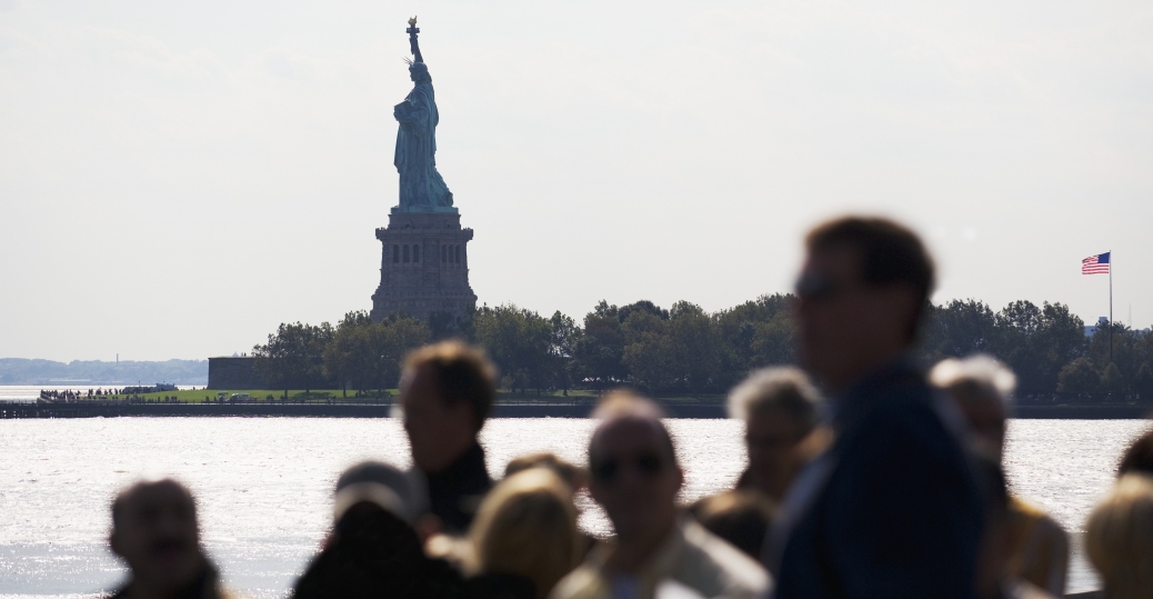 people on boat near statue of liberty P