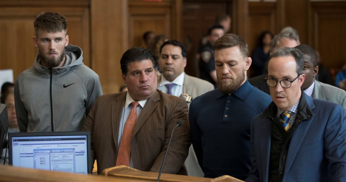 Mixed martial arts fighter Conor McGregor and Cian Cowley during their arraignment in a New York Cit