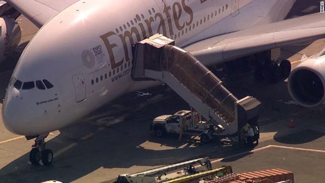 Plane Arrives at JFK Airport Carrying Dozens of Sick Travelers