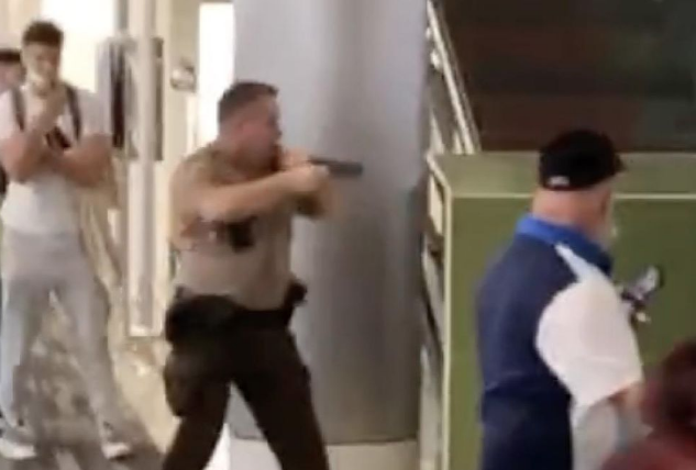 [WATCH] Cop Pulls Gun On Unarmed Travelers During Brawl at Miami Airport