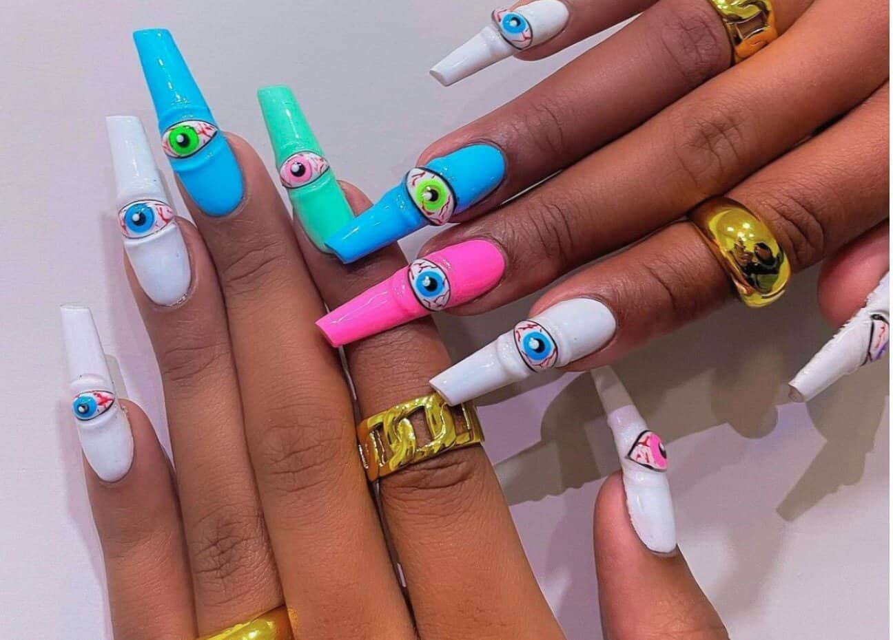 Megan Thee Stallion is seeing....ten? Each bloodshot eye was painted by hand