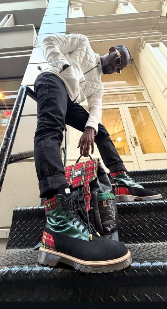 Boots with green satin and plaid accents, stylish urban outfit, man with designer accessories, city street fashion, trendy men's footwear and accessories for streetwear style, luxury casual fashion.